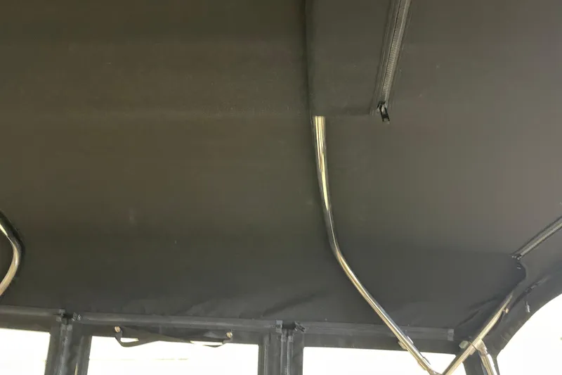 Slide: The Image of Interior view of 2004 Carver 420 Mariner boat canopy with metal supports. - 32
