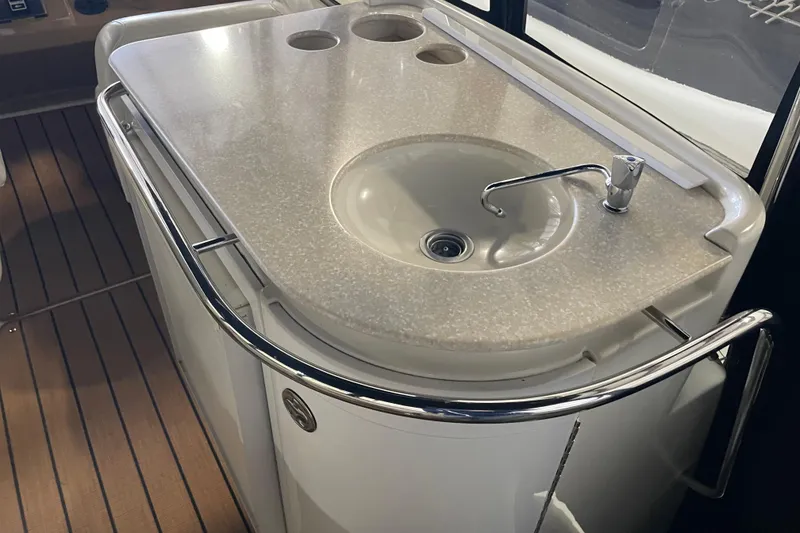 Slide: The Image of 2004 Carver 420 Mariner yacht sink with countertop and faucet in cabin interior. - 35