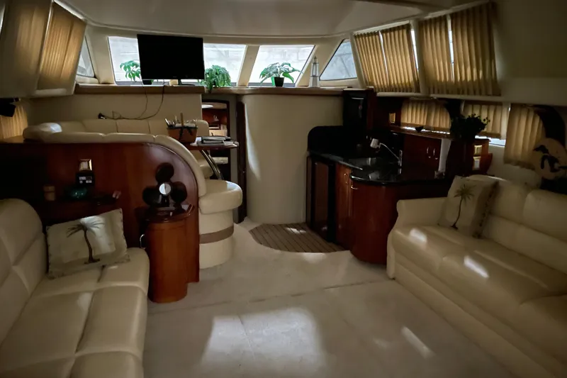 Slide: The Image of Luxurious interior of a 2004 Carver 420 Mariner yacht with elegant seating and modern amenities. - 6