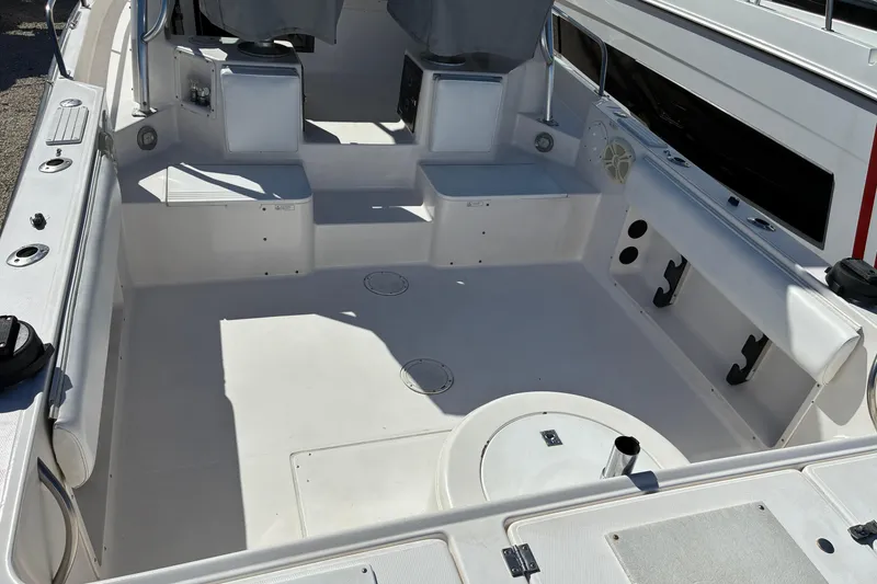 Slide: The Image of 1997 Hydra-Sports 2750 WA boat interior with spacious seating and storage compartments. - 4