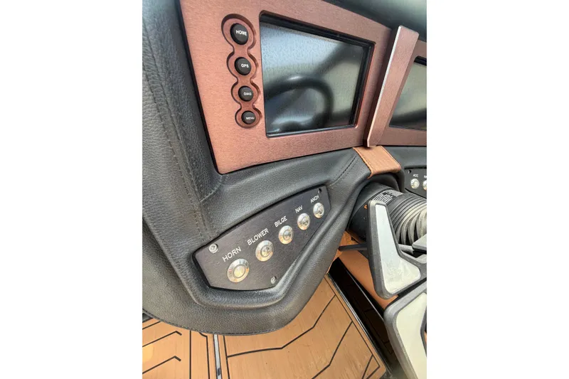 Slide: The Image of 2020 Centurion Ri237 dashboard with control buttons and display screens. - 13