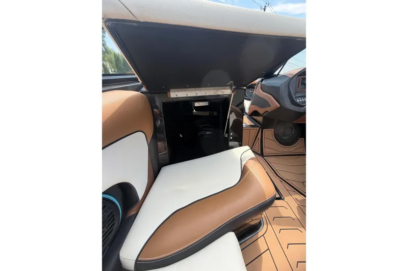 Slide: The Image of 2020 Centurion Ri237 interior with brown and white seating, open storage compartment. - 15