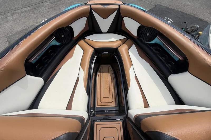 Slide: The Image of Luxurious interior of 2020 Centurion Ri237 boat with brown and white seating. - 18