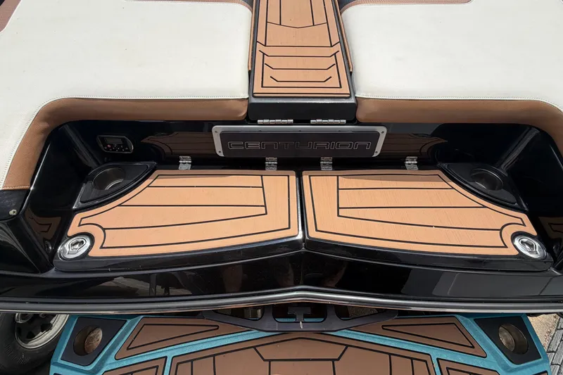 Slide: The Image of 2020 Centurion Ri237 boat deck with stylish wood-patterned design and logo. - 21