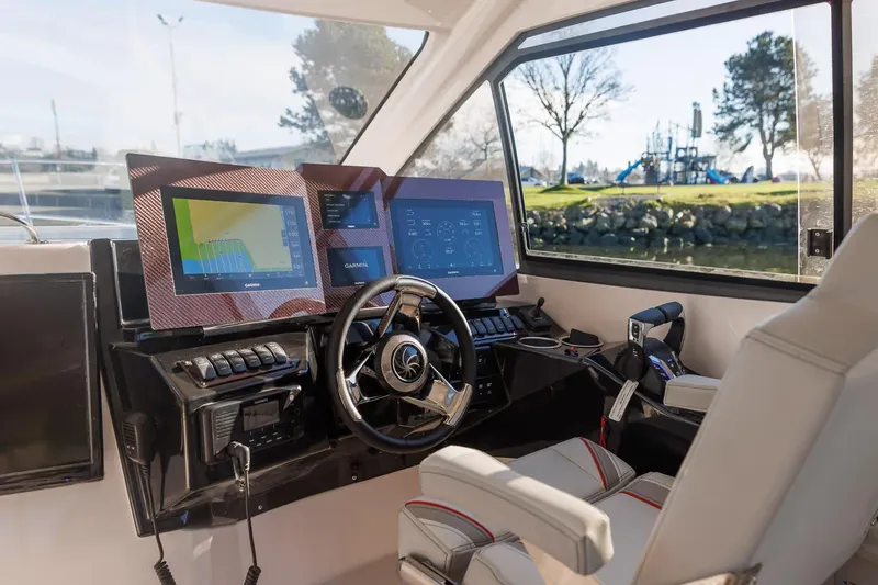 Slide: The Image of Manufacturer Provided Image: Interior of 2026 Solara S-310 SB boat with advanced navigation displays and controls. - 2