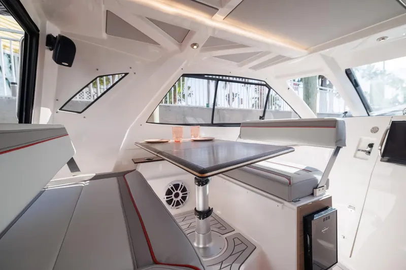 Slide: The Image of Manufacturer Provided Image: Luxurious interior of 2026 Solara S-310 SB boat with modern seating and table. - 4