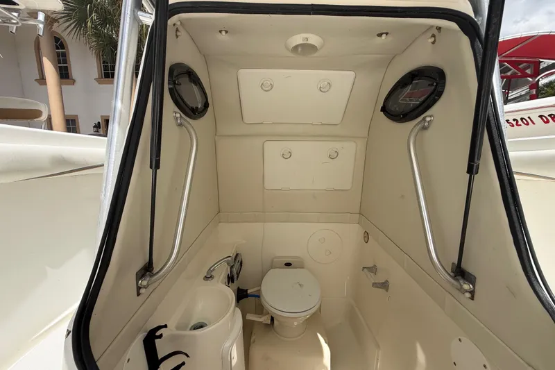 Slide: The Image of Interior of 2001 Wellcraft 29 Scarab Sport Open boat with compact marine toilet. - 102