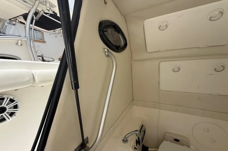 Slide: The Image of Interior view of 2001 Wellcraft 29 Scarab Sport Open boat cabin with storage compartments. - 104