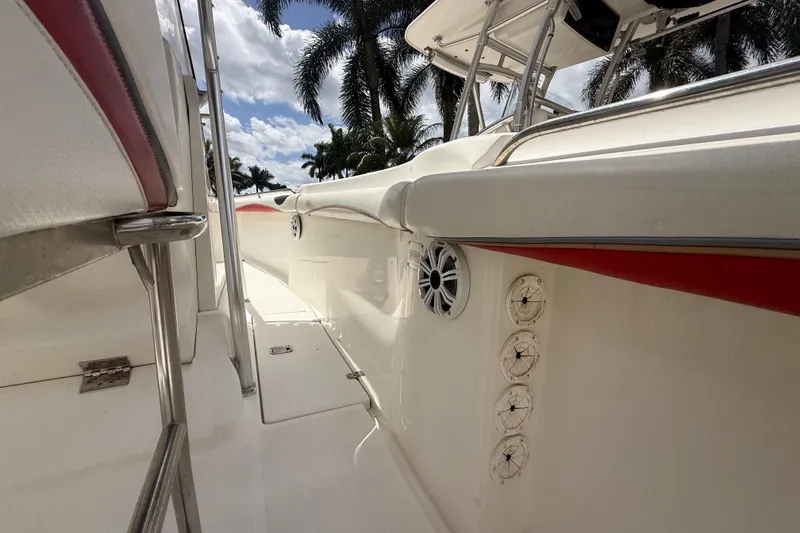 Slide: The Image of 2001 Wellcraft 29 Scarab Sport Open boat interior with speakers and stainless steel fittings. - 107