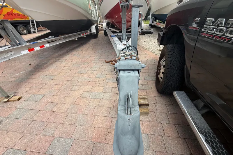 Slide: The Image of Trailer hitch of a 2001 Wellcraft 29 Scarab Sport Open boat on brick pavement. - 12