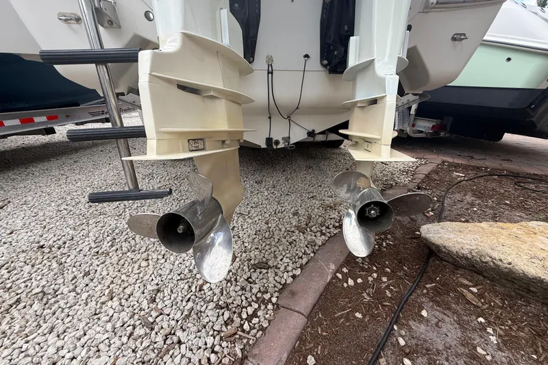 Slide: The Image of Rear view of 2001 Wellcraft 29 Scarab Sport Open boat with dual propellers. - 28