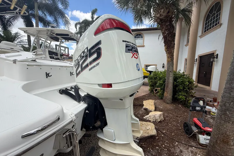 Slide: The Image of 2001 Wellcraft 29 Scarab Sport Open with Mercury Racing 225 XS engine, parked outdoors. - 32