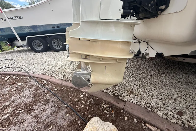 Slide: The Image of Outboard motor of a 2001 Wellcraft 29 Scarab Sport Open on a trailer. - 33