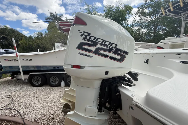 Slide: The Image of 2001 Wellcraft 29 Scarab Sport Open with Mercury Racing 225 engine, parked outdoors. - 35