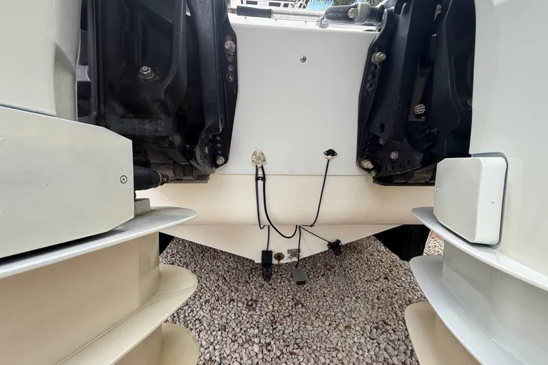 Slide: The Image of Rear view of a 2001 Wellcraft 29 Scarab Sport Open boat with dual engines. - 38