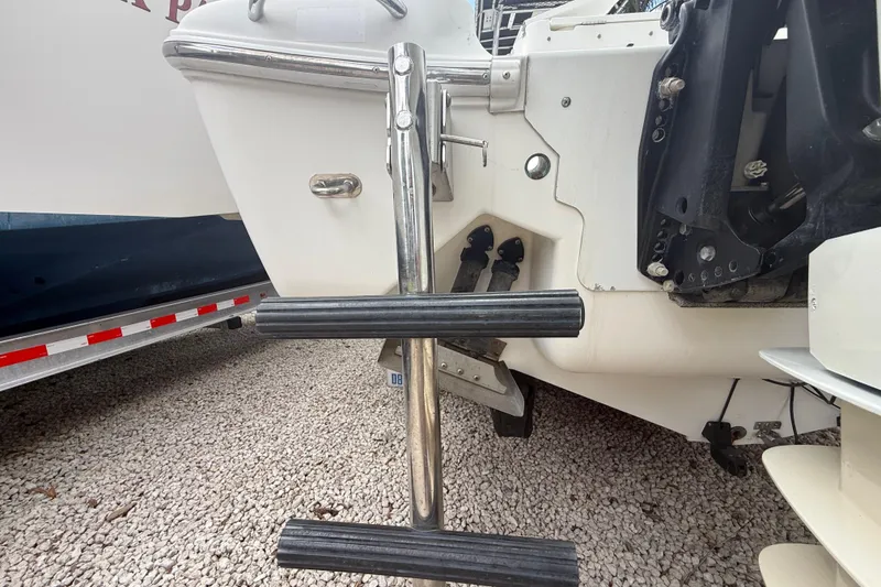 Slide: The Image of Rear view of 2001 Wellcraft 29 Scarab Sport Open boat ladder and motor mount. - 40
