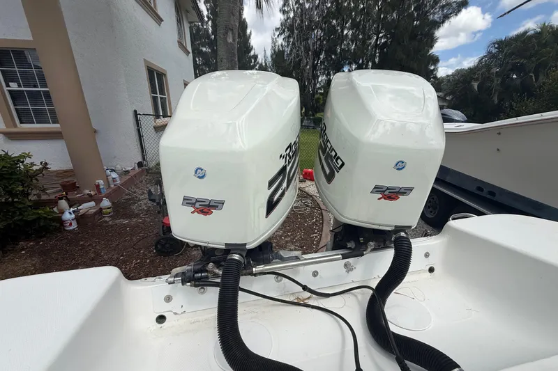 Slide: The Image of Twin Mercury 225 XS outboard engines on a 2001 Wellcraft 29 Scarab Sport Open boat. - 44