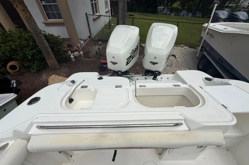 Slide: The Image of 2001 Wellcraft 29 Scarab Sport Open boat with dual outboard engines. - 49