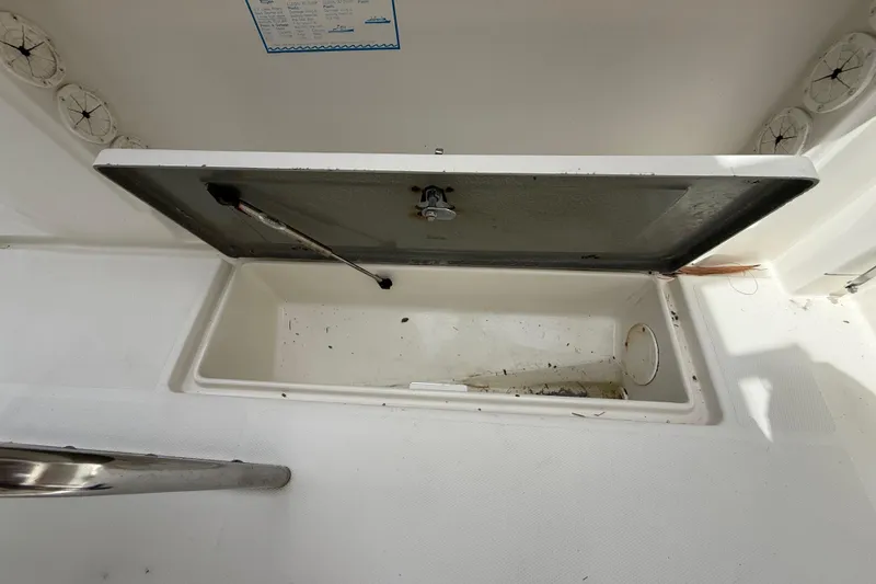 Slide: The Image of Open storage compartment on 2001 Wellcraft 29 Scarab Sport Open boat. - 53