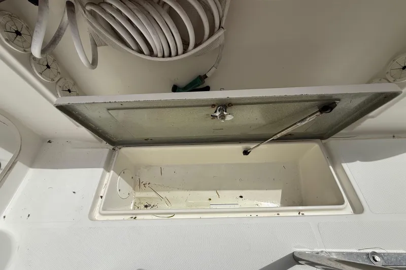 Slide: The Image of Open storage compartment on 2001 Wellcraft 29 Scarab Sport Open boat. - 55