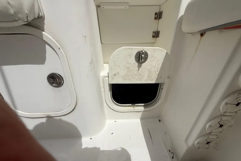 Slide: The Image of 2001 Wellcraft 29 Scarab Sport Open boat interior storage compartments. - 56