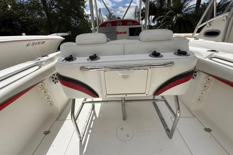 Slide: The Image of 2001 Wellcraft 29 Scarab Sport Open boat interior with seating and storage. - 57