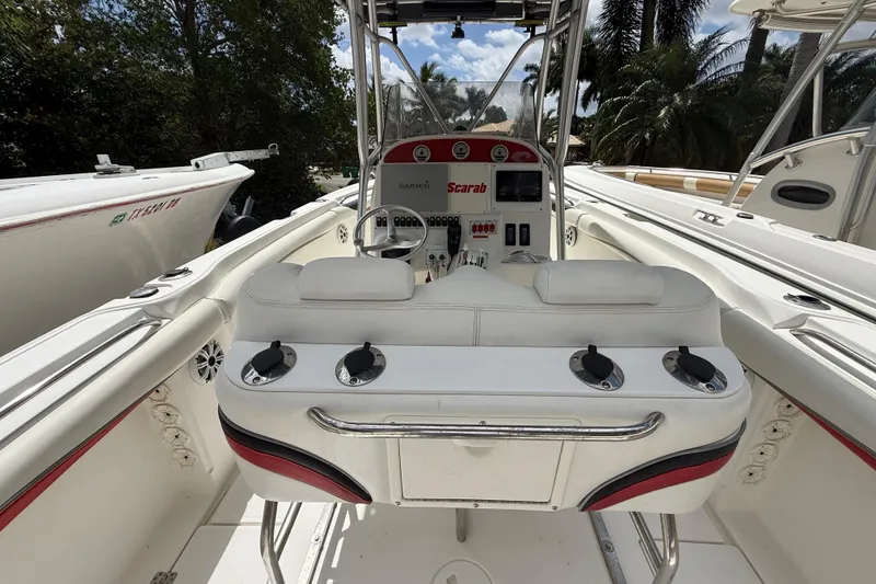 Slide: The Image of 2001 Wellcraft 29 Scarab Sport Open boat interior with steering console and seating. - 58