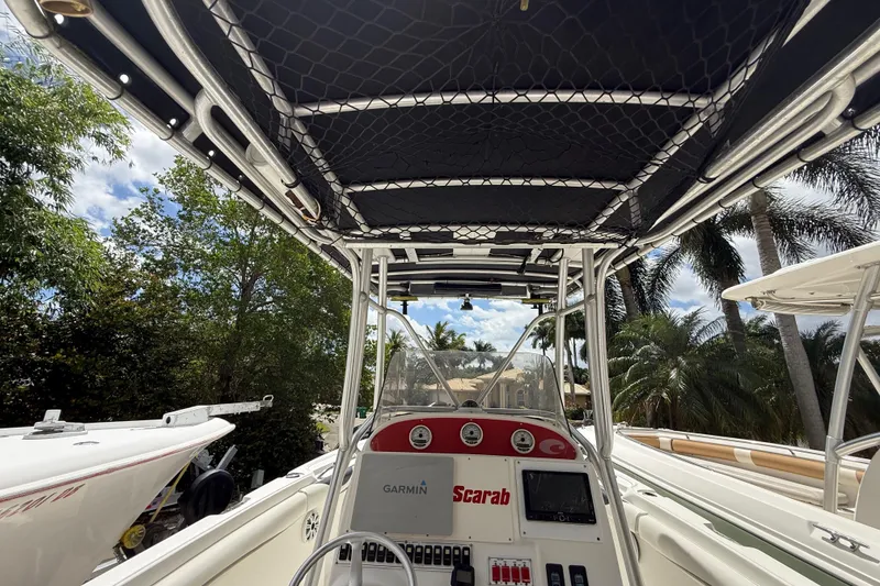 Slide: The Image of 2001 Wellcraft 29 Scarab Sport Open boat interior with Garmin navigation system. - 62