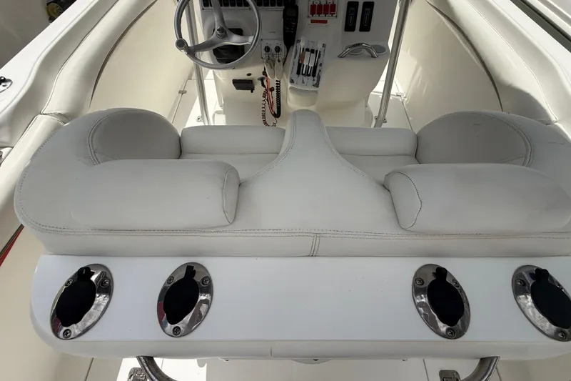 Slide: The Image of 2001 Wellcraft 29 Scarab Sport Open boat interior with white seating and steering console. - 63