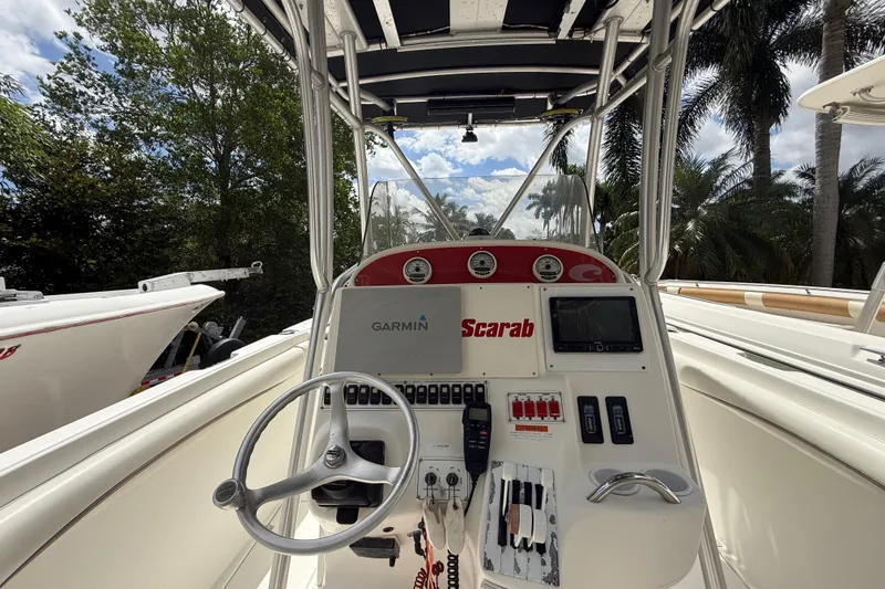 Slide: The Image of Center console of 2001 Wellcraft 29 Scarab Sport Open boat with Garmin navigation. - 65