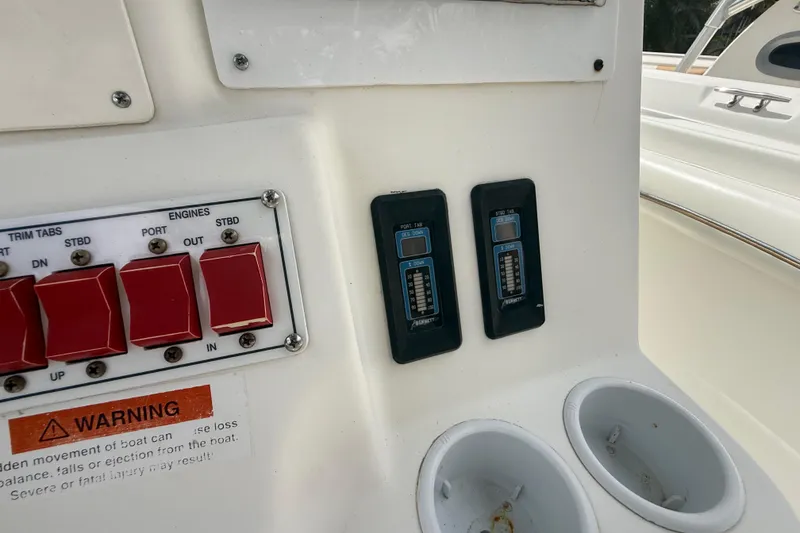 Slide: The Image of Control panel of a 2001 Wellcraft 29 Scarab Sport Open boat with warning label. - 71