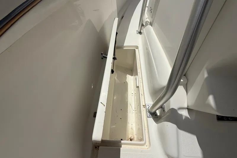 Slide: The Image of Open storage compartment on 2001 Wellcraft 29 Scarab Sport Open boat. - 79