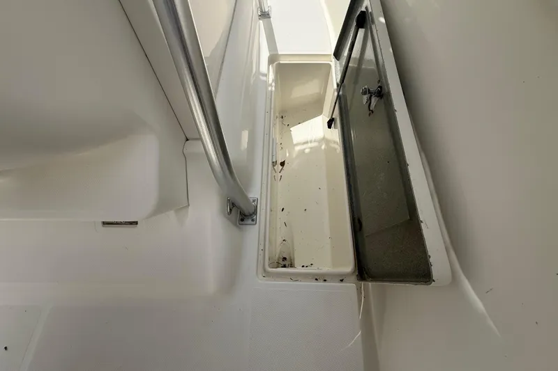 Slide: The Image of Open storage compartment on 2001 Wellcraft 29 Scarab Sport Open boat deck. - 80