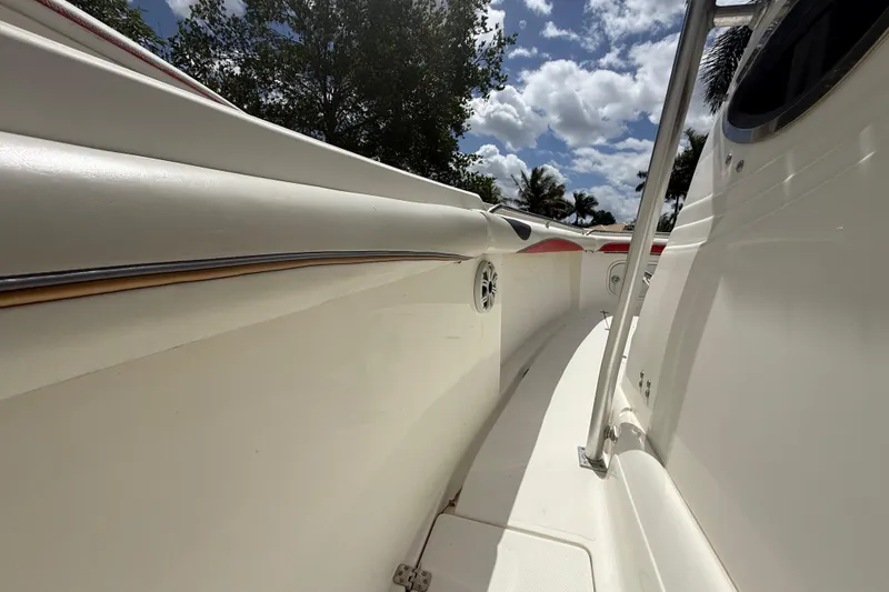 Slide: The Image of 2001 Wellcraft 29 Scarab Sport Open boat interior with sleek design and sunny sky. - 83