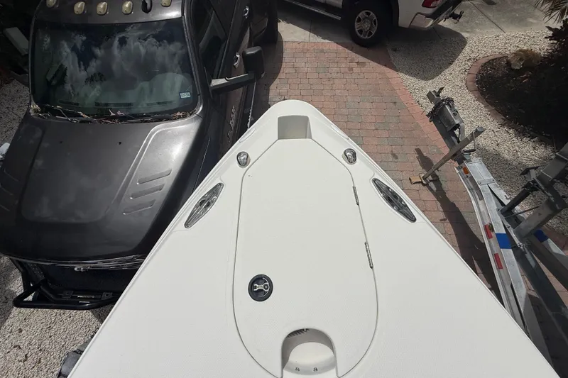 Slide: The Image of Top view of a 2001 Wellcraft 29 Scarab Sport Open boat on a trailer. - 92