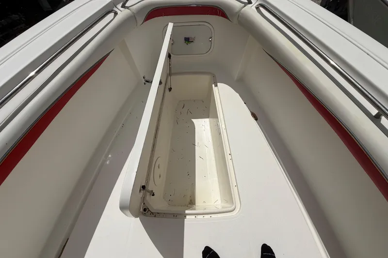 Slide: The Image of 2001 Wellcraft 29 Scarab Sport Open boat interior with open storage compartment. - 95