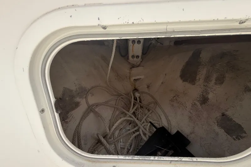 Slide: The Image of Storage compartment with ropes on a 2001 Wellcraft 29 Scarab Sport Open boat. - 97