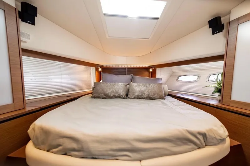 Slide: The Image of Luxurious bedroom interior of 2013 Sea Ray Sundancer 540 yacht with elegant bedding and natural light. - 10