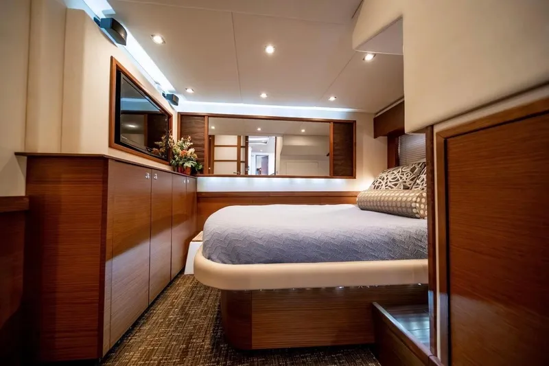 Slide: The Image of Luxurious 2013 Sea Ray Sundancer 540 yacht cabin with elegant wood finishes and modern lighting. - 13