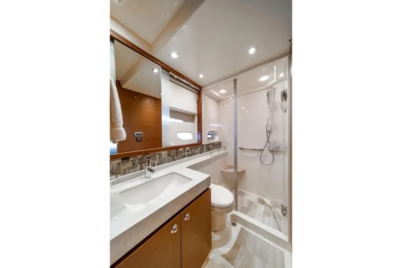 Slide: The Image of Luxurious bathroom in 2013 Sea Ray Sundancer 540 yacht with modern fixtures and elegant design. - 16