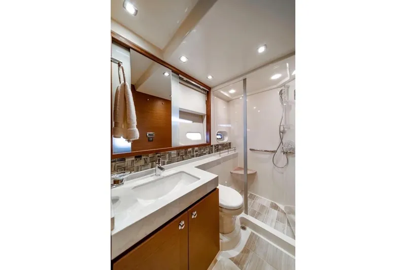 Slide: The Image of Luxurious bathroom in 2013 Sea Ray Sundancer 540 yacht with modern fixtures and elegant design. - 17