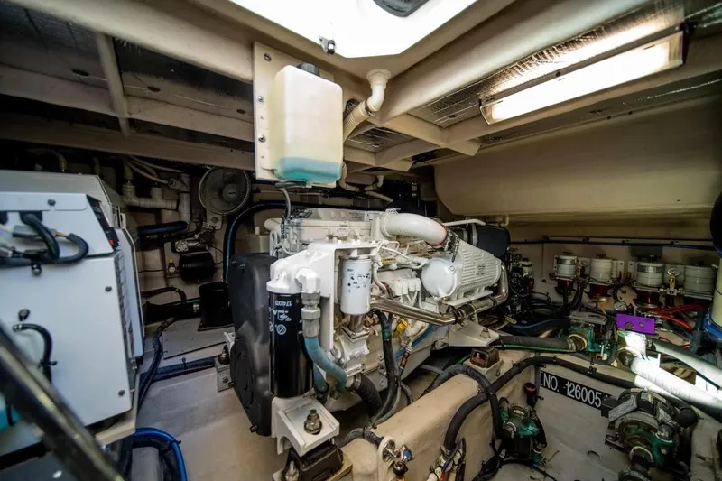 Slide: The Image of Engine room of 2013 Sea Ray Sundancer 540 yacht, showcasing mechanical components and systems. - 23