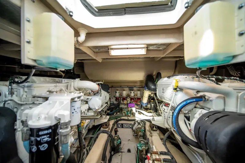 Slide: The Image of Engine room of 2013 Sea Ray Sundancer 540 yacht, showcasing dual engines and mechanical components. - 24