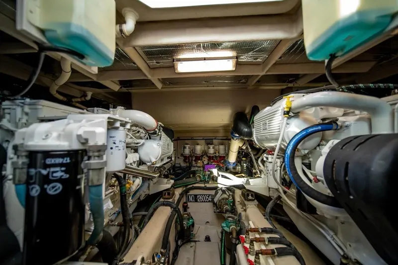 Slide: The Image of Engine room of a 2013 Sea Ray Sundancer 540 yacht, showcasing mechanical components. - 25