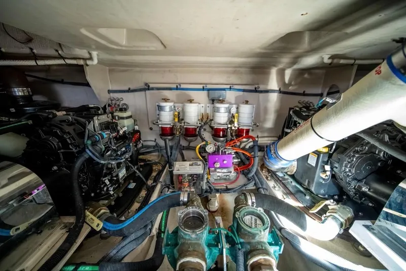 Slide: The Image of Engine room of 2013 Sea Ray Sundancer 540 yacht, showcasing mechanical components and systems. - 27