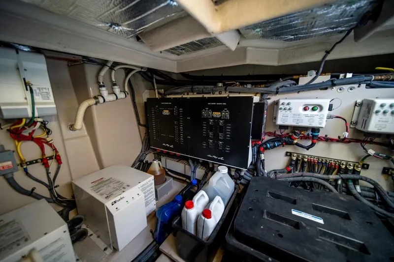 Slide: The Image of Engine room of 2013 Sea Ray Sundancer 540 with electrical panels and wiring. - 28