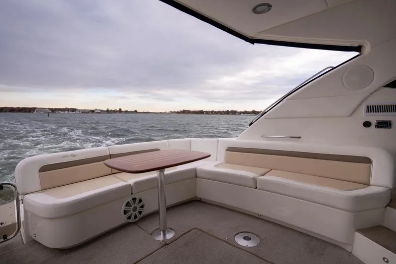 Slide: The Image of 2013 Sea Ray Sundancer 540 yacht interior with elegant seating and ocean view. - 29