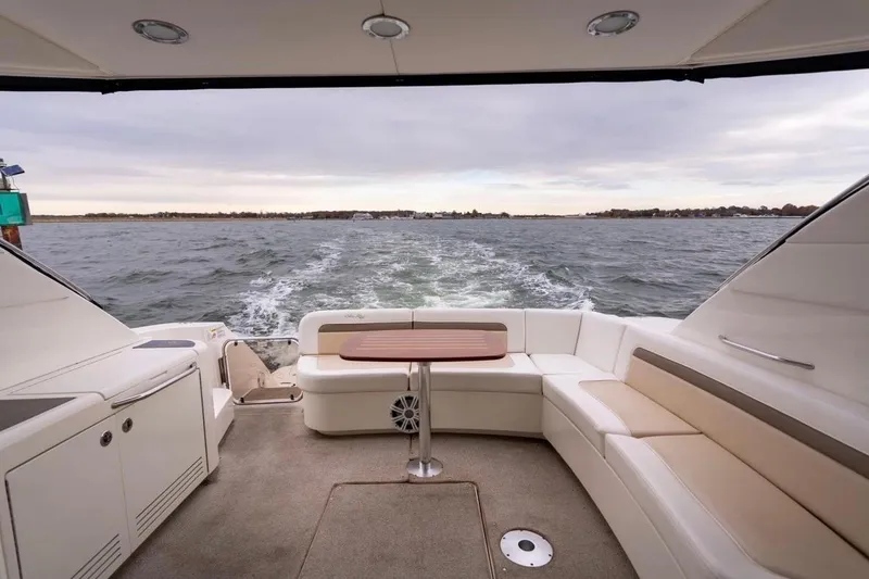 Slide: The Image of Luxurious 2013 Sea Ray Sundancer 540 yacht interior with ocean view and elegant seating. - 30