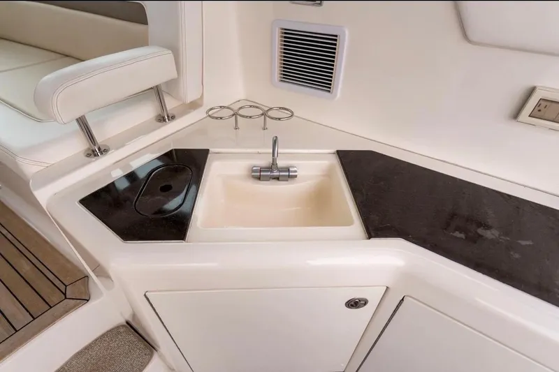 Slide: The Image of 2013 Sea Ray Sundancer 540 yacht interior with sink and countertop. - 33