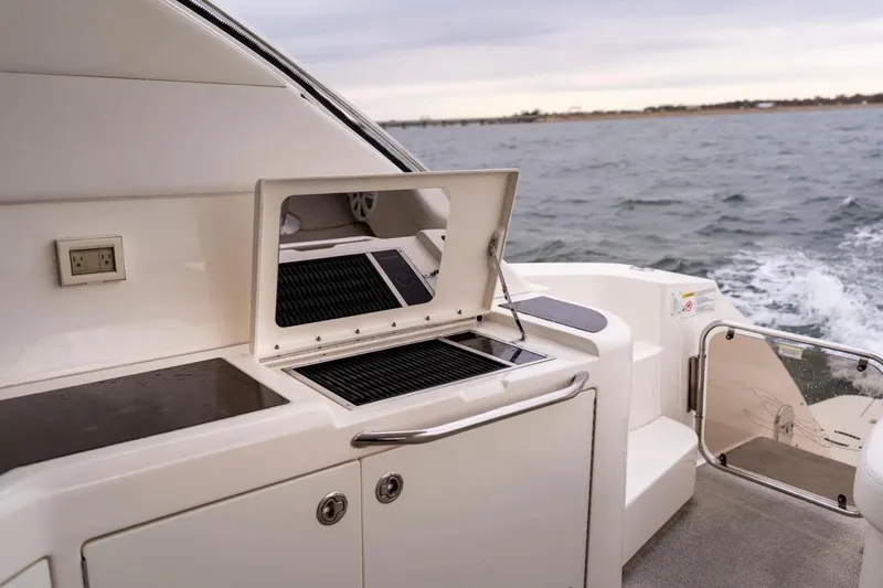 Slide: The Image of Outdoor grill on 2013 Sea Ray Sundancer 540 yacht, cruising on open water. - 34